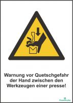 Warnung vor Quetschgefahr der hand zwischen den werkzeugen einer presse